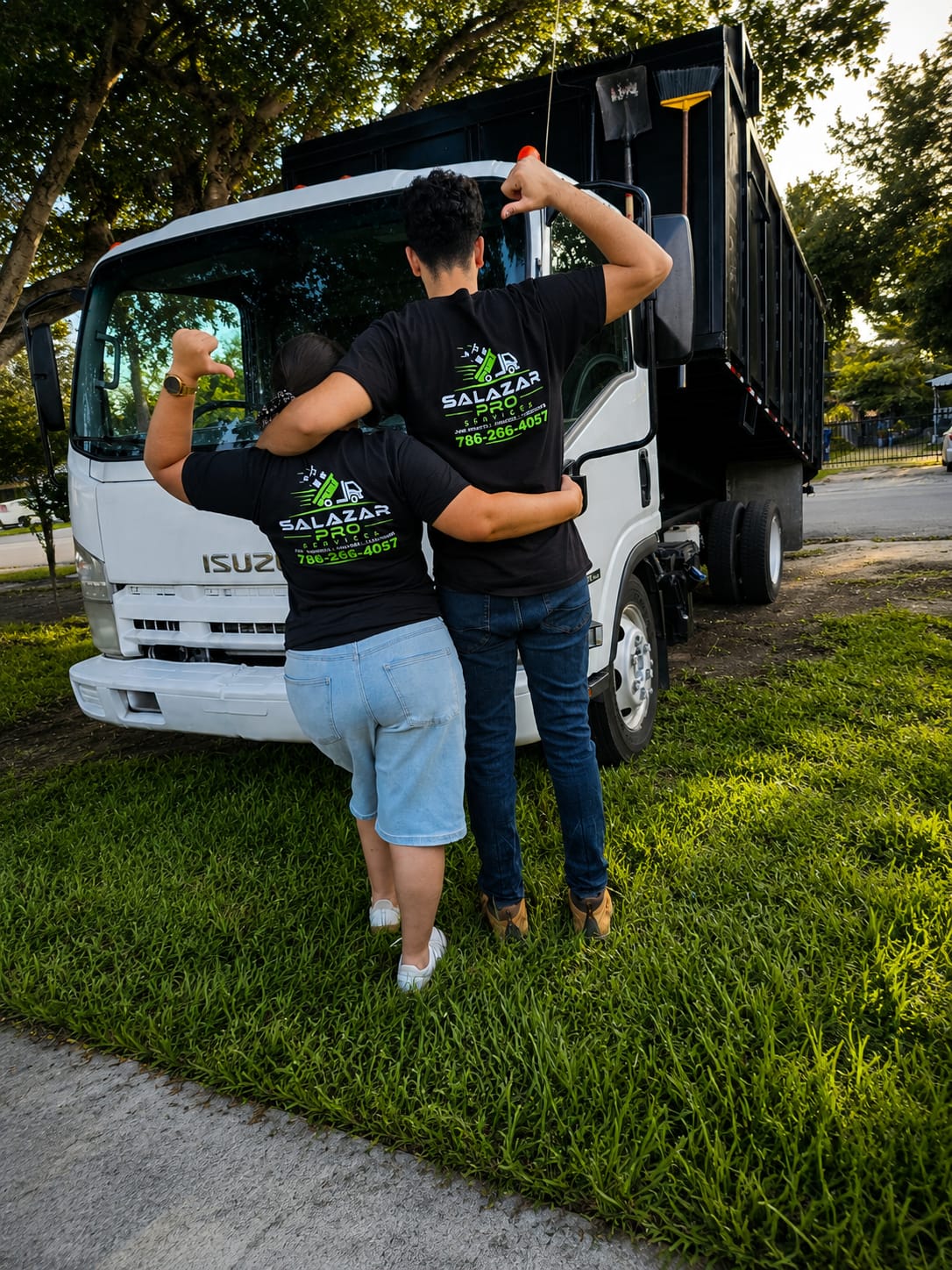 Sheila Peláez Sánchez and crew member with the Salazar Pro Services truck